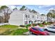 Charming townhome exterior with well-maintained landscaping and assigned parking space at 2352 Lake Woodberry Cir, Brandon, FL 33510