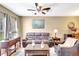 Living area with a comfortable sofa, stylish lamps, and hardwood floors at 2352 Lake Woodberry Cir, Brandon, FL 33510