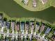 Overhead aerial shot of residences backing onto a lake, with well-maintained lawns and neighborhood streets at 29011 Trevi Pl, Wesley Chapel, FL 33543