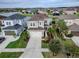 Charming two-story home with lush landscaping, set within a picturesque waterfront community at 29011 Trevi Pl, Wesley Chapel, FL 33543