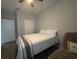 Bedroom with neutral walls, carpet flooring, a queen bed and ceiling fan at 29011 Trevi Pl, Wesley Chapel, FL 33543