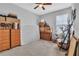 Bedroom with neutral walls, ceiling fan, and natural light coming from the window at 29011 Trevi Pl, Wesley Chapel, FL 33543