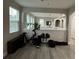 Second-floor bonus room providing versatile space for exercise equipment, with a view of the downstairs area at 29011 Trevi Pl, Wesley Chapel, FL 33543
