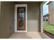 Elegant front entry with a decorative glass door and covered porch, creating a welcoming entrance at 29011 Trevi Pl, Wesley Chapel, FL 33543