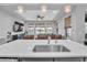 Bright, open concept showcasing kitchen island with living space, perfect for modern living at 29011 Trevi Pl, Wesley Chapel, FL 33543