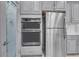 Modern kitchen featuring a stainless-steel refrigerator, double oven, and walk-in pantry at 29011 Trevi Pl, Wesley Chapel, FL 33543