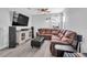 Living room featuring an oversized sectional, sleek lighting, and vinyl flooring at 29011 Trevi Pl, Wesley Chapel, FL 33543
