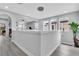 Loft area with natural light, neutral walls, and views into other living areas at 29011 Trevi Pl, Wesley Chapel, FL 33543