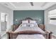 Spacious main bedroom with tray ceiling, wood furniture, and natural light at 29011 Trevi Pl, Wesley Chapel, FL 33543
