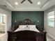 Spacious main bedroom featuring tray ceilings, two-toned walls, and and nightstands at 29011 Trevi Pl, Wesley Chapel, FL 33543