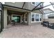 Enjoy outdoor living with this screened patio and an outside seating area at 29011 Trevi Pl, Wesley Chapel, FL 33543
