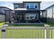 A screened patio featuring outdoor furniture at 29011 Trevi Pl, Wesley Chapel, FL 33543