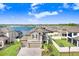 Beautiful aerial view of the home backing onto a large lake in a Gathering-friendly neighborhood at 3027 Marine Grass Dr, Wimauma, FL 33598