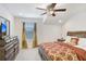 Comfortable bedroom with carpet floor, a large bed and a dresser at 3027 Marine Grass Dr, Wimauma, FL 33598