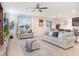Bright and airy living room with neutral tones, comfortable seating, and stylish decor at 3027 Marine Grass Dr, Wimauma, FL 33598