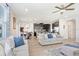 Open concept living space with kitchen, dining area, and comfortable seating at 3027 Marine Grass Dr, Wimauma, FL 33598