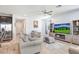 Inviting living space with a cozy fireplace, comfortable seating, and modern decor at 3027 Marine Grass Dr, Wimauma, FL 33598