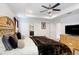 Comfortable main bedroom with a large bed, soft pillows, and a TV at 3027 Marine Grass Dr, Wimauma, FL 33598