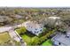 Expansive property with a pool, complemented by mature landscaping, as seen from above at 3201 S Manhattan Ave, Tampa, FL 33629