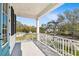 Outdoor balcony with white metal railings and view of the neighborhood street at 3201 S Manhattan Ave, Tampa, FL 33629