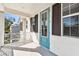 Outdoor balcony with blue door and view of the neighborhood at 3201 S Manhattan Ave, Tampa, FL 33629