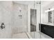 Bathroom featuring a tiled walk-in shower, gray tile and modern fixtures at 3201 S Manhattan Ave, Tampa, FL 33629