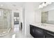 Bright bathroom featuring a glass walk-in shower, and double vanity at 3201 S Manhattan Ave, Tampa, FL 33629