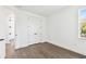 Bedroom with hardwood floors, closet, and bright window at 3201 S Manhattan Ave, Tampa, FL 33629