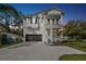 Charming two-story home featuring a welcoming front porch and a spacious two-car garage at 3201 S Manhattan Ave, Tampa, FL 33629