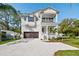 Charming two-story home featuring a welcoming front porch and a spacious two-car garage at 3201 S Manhattan Ave, Tampa, FL 33629