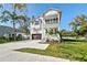 Attractive two-story home with a two-car garage, complemented by lush landscaping at 3201 S Manhattan Ave, Tampa, FL 33629