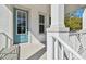 Welcoming porch with a charming blue door and white accents at 3201 S Manhattan Ave, Tampa, FL 33629