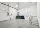 Clean, well-lit garage featuring epoxy floors, utility connections, and ample storage space at 3201 S Manhattan Ave, Tampa, FL 33629