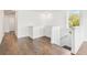 Second floor hallway with hardwood floors, white trim and a view of staircase at 3201 S Manhattan Ave, Tampa, FL 33629