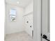 Laundry room with tiled floors and utility hookups at 3201 S Manhattan Ave, Tampa, FL 33629