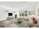 Beautifully staged living room featuring large windows with great natural light at 3201 S Manhattan Ave, Tampa, FL 33629