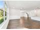 Open-concept living space with hardwood floors and lots of natural light at 3201 S Manhattan Ave, Tampa, FL 33629