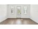 Bright living room with hardwood floors and door to small balcony at 3201 S Manhattan Ave, Tampa, FL 33629
