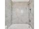 Bathroom shower with tiled walls and recessed shelf at 3201 S Manhattan Ave, Tampa, FL 33629