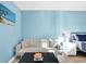 Comfortable seating area located in bedroom area with a large window at 3711 1St S Ave, St Petersburg, FL 33711