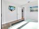 Serene bedroom featuring a mounted TV, closet, and soothing wall art, creating a relaxing retreat at 3711 1St S Ave, St Petersburg, FL 33711