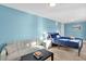 Spacious bedroom with a seating area, large bed and colorful decor at 3711 1St S Ave, St Petersburg, FL 33711