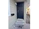 Close up of a dark blue front door with a security camera and modern lock at 3711 1St S Ave, St Petersburg, FL 33711