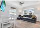 Inviting living space with hardwood floors, a comfortable sofa, and an adjacent dining area at 3711 1St S Ave, St Petersburg, FL 33711