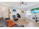 Comfortable living space with a sofa, dining area, and entertainment setup, ideal for relaxing and enjoying media at 3711 1St S Ave, St Petersburg, FL 33711