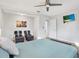Spacious main bedroom featuring hardwood floors, ample seating, and a modern ceiling fan at 3711 1St S Ave, St Petersburg, FL 33711