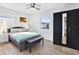 Bright main bedroom showcases a large closet and wood-look flooring at 3711 1St S Ave, St Petersburg, FL 33711