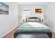 A serene main bedroom features beach-themed decor and modern lighting at 3711 1St S Ave, St Petersburg, FL 33711