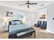 A relaxing main bedroom boasts modern furnishings and a ceiling fan at 3711 1St S Ave, St Petersburg, FL 33711