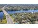 Panoramic aerial view of the property with a river and bridge nearby at 3820 E Lakeshore Dr, Tampa, FL 33604